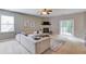 Bright living room features a fireplace, ceiling fan, and sliding glass doors at 4092 Duran Ln, Auburn, GA 30011