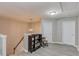 Loft space with a bookcase, rocking chair, and neutral-toned walls at 4092 Duran Ln, Auburn, GA 30011