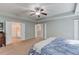 Spacious main bedroom with french doors leading into the main bathroom at 4092 Duran Ln, Auburn, GA 30011