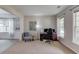 A spacious office features neutral carpet, wainscotting, and plenty of natural light at 4092 Duran Ln, Auburn, GA 30011