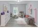 Spacious playroom with cubbies, a play kitchen, and comfy seating area at 4092 Duran Ln, Auburn, GA 30011