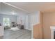 Bright playroom with a play kitchen, seating area, and gray wood floors at 4092 Duran Ln, Auburn, GA 30011