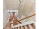 Carpeted staircase with wooden railing, leading to the home's upper level at 4092 Duran Ln, Auburn, GA 30011
