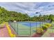 Outside view of the community's two tennis courts with professional green and blue coloring at 4092 Duran Ln, Auburn, GA 30011