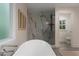 Luxurious bathroom featuring marble accents, a glass-enclosed shower, and modern fixtures at 1218 Crestwood Se Dr, Atlanta, GA 30316