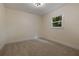 Bedroom with neutral carpet, neutral walls, natural light, and modern light fixture at 1218 Crestwood Se Dr, Atlanta, GA 30316