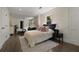 Bright bedroom with hardwood floors, a comfortable bed, and an attached seating area at 1218 Crestwood Se Dr, Atlanta, GA 30316