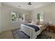 Cozy bedroom with natural light, hardwood floors and large windows overlooking the front yard at 1218 Crestwood Se Dr, Atlanta, GA 30316