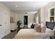 Spacious bedroom featuring hardwood floors, a seating area, and abundant natural light at 1218 Crestwood Se Dr, Atlanta, GA 30316