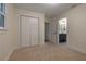 Bedroom with neutral carpet, neutral walls, closet, leading into bathroom at 1218 Crestwood Se Dr, Atlanta, GA 30316