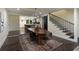 Elegant dining area with modern table, seating for six, open to the kitchen and living room at 1218 Crestwood Se Dr, Atlanta, GA 30316