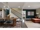 Inviting dining room featuring modern light fixtures, staircase, and an open layout at 1218 Crestwood Se Dr, Atlanta, GA 30316