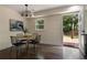 Dining room with hardwood floors, a modern chandelier, and backyard views at 1218 Crestwood Se Dr, Atlanta, GA 30316