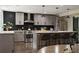 Well-lit eat-in kitchen featuring a large island, stainless appliances, and modern fixtures at 1218 Crestwood Se Dr, Atlanta, GA 30316