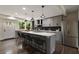 Modern kitchen with stainless steel appliances, gray cabinetry, and a stylish island with seating at 1218 Crestwood Se Dr, Atlanta, GA 30316