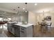 Bright, open concept kitchen with a large island and adjacent dining area and hardwood floors at 1218 Crestwood Se Dr, Atlanta, GA 30316