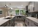 Modern kitchen featuring gray cabinets, stainless steel appliances, and quartz countertops at 1218 Crestwood Se Dr, Atlanta, GA 30316