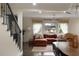View of the living room from the dining area, with natural light and stylish furniture at 1218 Crestwood Se Dr, Atlanta, GA 30316
