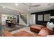 Open concept living space featuring a modern sectional sofa, dining area, and staircase at 1218 Crestwood Se Dr, Atlanta, GA 30316