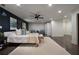 Spacious main bedroom features a ceiling fan, dark accent wall, and plush rug at 1218 Crestwood Se Dr, Atlanta, GA 30316