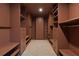 Large walk-in closet with custom shelving, providing extensive storage capacity and organization at 1218 Crestwood Se Dr, Atlanta, GA 30316