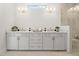 Bright bathroom featuring a double sink vanity, white cabinets, and gold fixtures at 309 Brooke View Trail, Canton, GA 30115