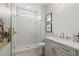 Modern bathroom featuring a glass-enclosed shower, sleek vanity, and decorative accents at 309 Brooke View Trail, Canton, GA 30115