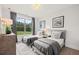 Bedroom featuring two twin beds, a large window, and light gray bedding at 309 Brooke View Trail, Canton, GA 30115