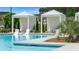 Inviting community pool area with cabanas, lounge chairs, lush greenery, and refreshing water at 309 Brooke View Trail, Canton, GA 30115