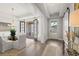 A bright and airy dining area with french doors and modern chandelier at 309 Brooke View Trail, Canton, GA 30115