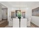 Elegant dining room featuring a modern chandelier, neutral color scheme, and space for entertaining at 309 Brooke View Trail, Canton, GA 30115