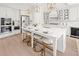 Gourmet kitchen features seating at a large center island with quartz counters and high-end stainless steel appliances at 309 Brooke View Trail, Canton, GA 30115