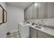 Well-equipped laundry room with modern appliances, ample cabinet space, and stylish flooring at 309 Brooke View Trail, Canton, GA 30115