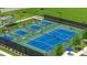 An aerial view of green and blue outdoor pickleball courts with lights and seating at 309 Brooke View Trail, Canton, GA 30115