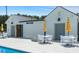 Community pool bar with an outdoor seating area that includes tables and umbrellas at 309 Brooke View Trail, Canton, GA 30115
