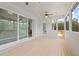 Inviting porch with wood flooring, ceiling fans, and serene views of the surrounding landscape at 309 Brooke View Trail, Canton, GA 30115