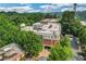 Aerial view showcasing building architecture surrounded by lush trees and greenery at 560 Dutch Valley Road # 2412, Atlanta, GA 30324