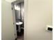 Charming half bathroom with pedestal sink, modern vanity lights, and neutral tones for a clean, contemporary look at 560 Dutch Valley Road # 2412, Atlanta, GA 30324