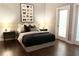 Serene bedroom featuring a comfortable bed, modern decor, and an ensuite bathroom at 560 Dutch Valley Road # 2412, Atlanta, GA 30324