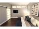 Stylish bedroom featuring a sliding barn door, TV, and contemporary decor at 560 Dutch Valley Road # 2412, Atlanta, GA 30324