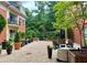Charming courtyard featuring brick pavers, potted plants, and comfortable seating, perfect for outdoor enjoyment at 560 Dutch Valley Road # 2412, Atlanta, GA 30324