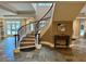 Grand entryway with a winding staircase, tile flooring, and neutral color scheme at 560 Dutch Valley Road # 2412, Atlanta, GA 30324