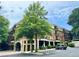Beautiful building exterior with balconies, manicured landscaping, and convenient parking at 560 Dutch Valley Road # 2412, Atlanta, GA 30324