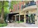 Modern restaurant exterior with outdoor seating and large windows at 560 Dutch Valley Road # 2412, Atlanta, GA 30324