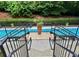 Beautiful swimming pool with stairs and railing access, surrounded by manicured landscaping for a peaceful ambiance at 560 Dutch Valley Road # 2412, Atlanta, GA 30324