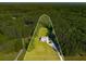 Lovely home on expansive acreage with driveway and surrounded by luscious forest and large green yard at 692 Brooks Woolsey Rd, Brooks, GA 30205