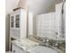 Bathroom featuring white cabinet, marble countertop, and tub with shower at 692 Brooks Woolsey Rd, Brooks, GA 30205