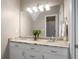 Bright bathroom featuring dual sinks with marble countertops and modern lighting at 692 Brooks Woolsey Rd, Brooks, GA 30205