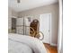 Bedroom boasts a wrought iron bed and an antique desk near the doorways at 692 Brooks Woolsey Rd, Brooks, GA 30205