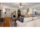 Comfortable living room showcases hardwood floors and provides an open floor concept to the kitchen at 692 Brooks Woolsey Rd, Brooks, GA 30205
